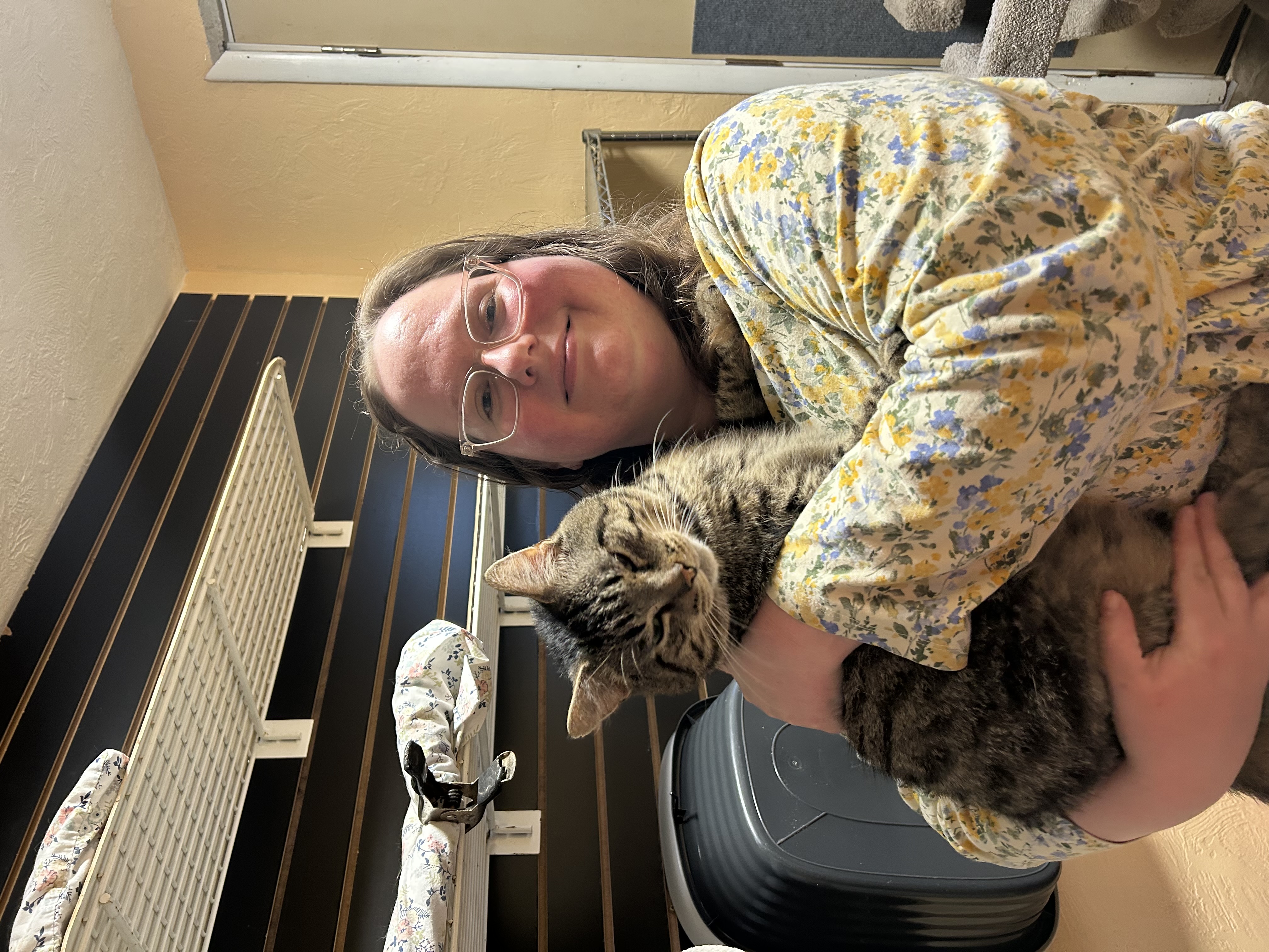 Picture of Teresa holding a tabby cat 